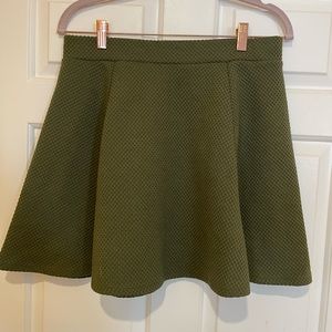 Three H&M skater skirts, size medium in black, green and grey